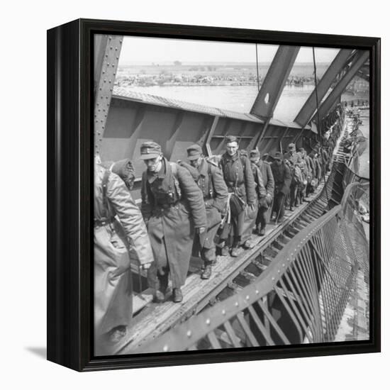German Soldiers Walk over Elbe River to Surrender to Allied Forces in the Waning Days of WWII-William Vandivert-Framed Premier Image Canvas