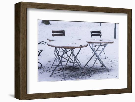 Germany, Bavaria, Munich. Hofgarten Park with early snow on cafe tables-Walter Bibikow-Framed Photographic Print