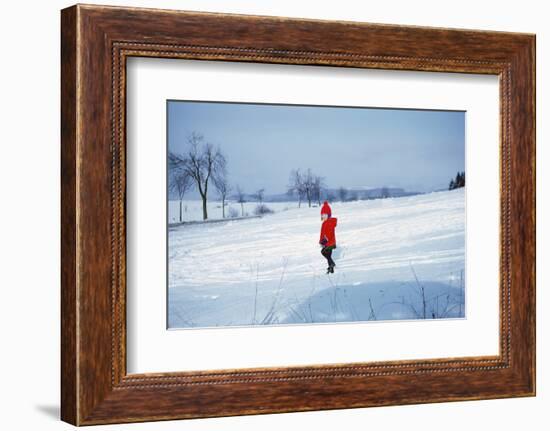 Germany - Bielefeld - 1960's Child Plays in Snow-Richard Baker-Framed Photographic Print