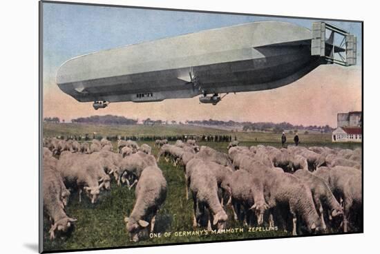 Germany - View of a Zeppelin Blimp over Grazing Sheep-Lantern Press-Mounted Art Print