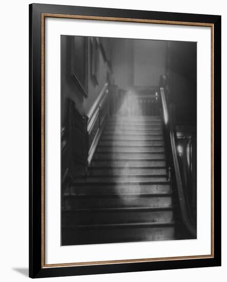 Ghost Descending the Staircase at Raynham Hall, Norfolk, England--Framed Photographic Print