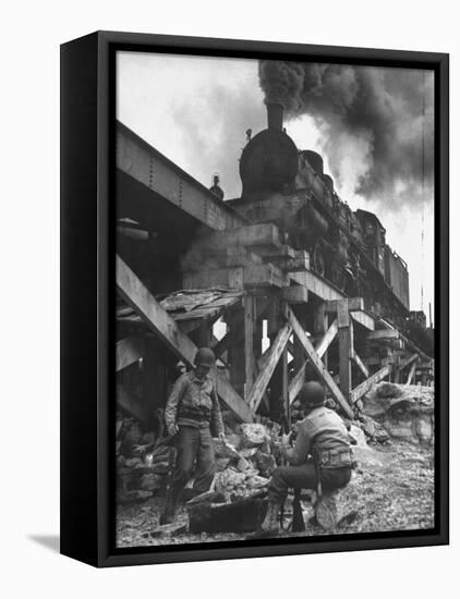 Gi Infantry Guards Keeping Warm by a Fire Next to an Army Engineer Built Railroad Bridge-Ralph Morse-Framed Premier Image Canvas