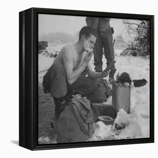 GI shaving with mirror during ull in the Ardennes Forest Conflict called the Battle of the Bulge-John Florea-Framed Premier Image Canvas