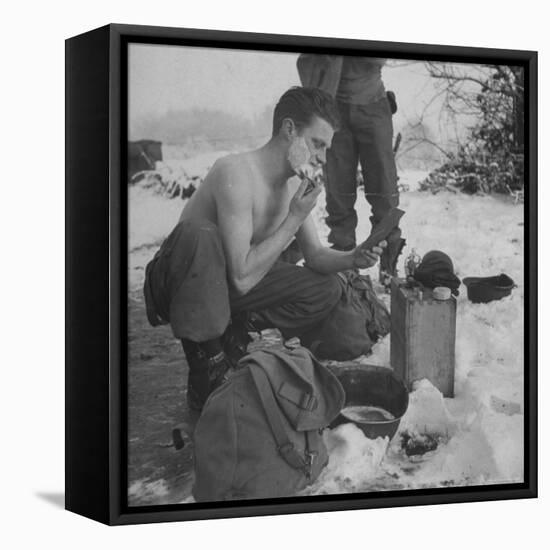 GI shaving with mirror during ull in the Ardennes Forest Conflict called the Battle of the Bulge-John Florea-Framed Premier Image Canvas