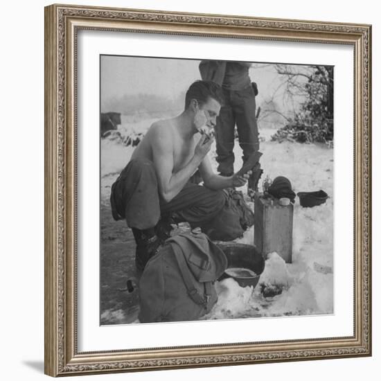 GI shaving with mirror during ull in the Ardennes Forest Conflict called the Battle of the Bulge-John Florea-Framed Photographic Print