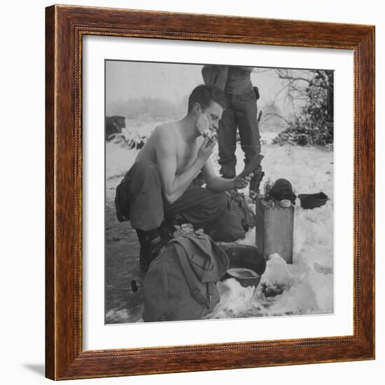 GI shaving with mirror during ull in the Ardennes Forest Conflict called the Battle of the Bulge-John Florea-Framed Photographic Print