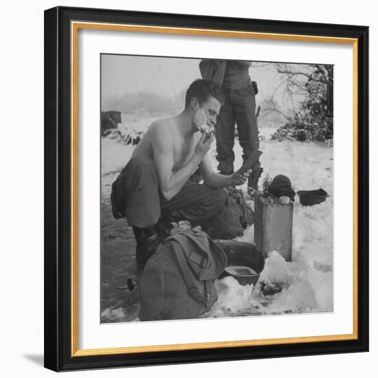 GI shaving with mirror during ull in the Ardennes Forest Conflict called the Battle of the Bulge-John Florea-Framed Photographic Print
