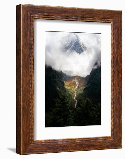 Giant mountain emerging through the clouds in the Himalayas, Nepal on the way to Everest Base Camp-David Chang-Framed Photographic Print