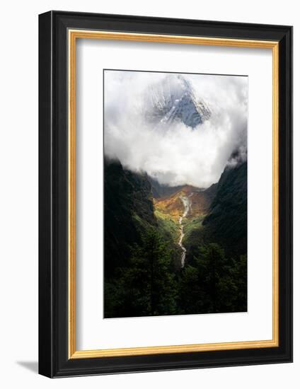 Giant mountain emerging through the clouds in the Himalayas, Nepal on the way to Everest Base Camp-David Chang-Framed Photographic Print