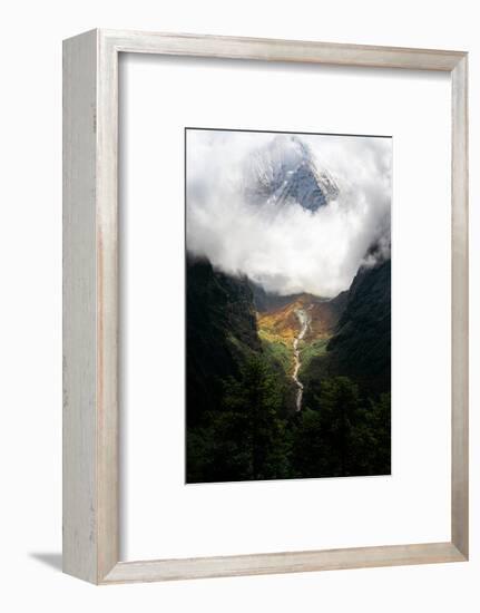 Giant mountain emerging through the clouds in the Himalayas, Nepal on the way to Everest Base Camp-David Chang-Framed Premium Photographic Print