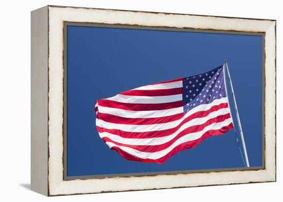 Giant US flag flying beneath a deep blue sky above Truman Avenue, Old Town-David Tomlinson-Framed Premier Image Canvas