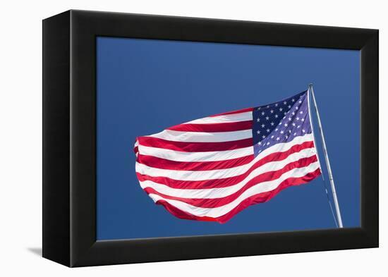 Giant US flag flying beneath a deep blue sky above Truman Avenue, Old Town-David Tomlinson-Framed Premier Image Canvas