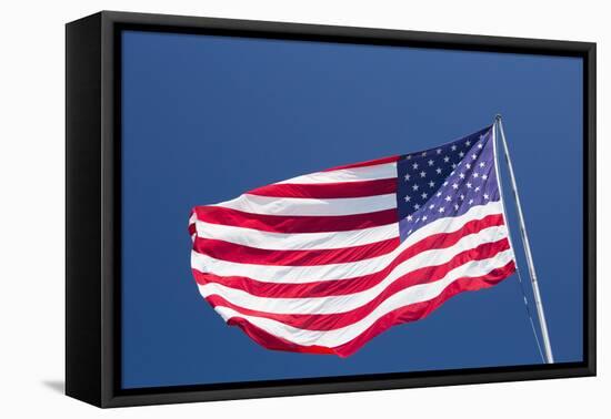 Giant US flag flying beneath a deep blue sky above Truman Avenue, Old Town-David Tomlinson-Framed Premier Image Canvas