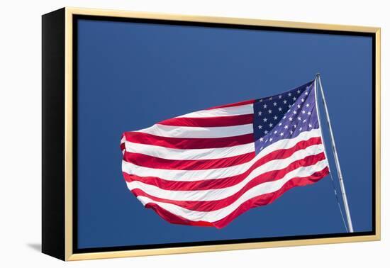 Giant US flag flying beneath a deep blue sky above Truman Avenue, Old Town-David Tomlinson-Framed Premier Image Canvas