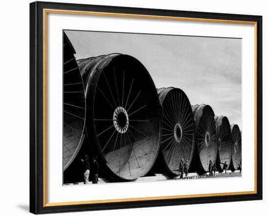 Gigantic Pipe Segments Used for Diverting the Missouri River During Construction of Fort Peck Dam-Margaret Bourke-White-Framed Photographic Print