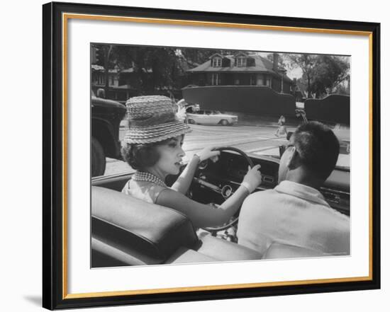 Gina Lollobrigida Taking a Driving Lesson-Peter Stackpole-Framed Premium Photographic Print