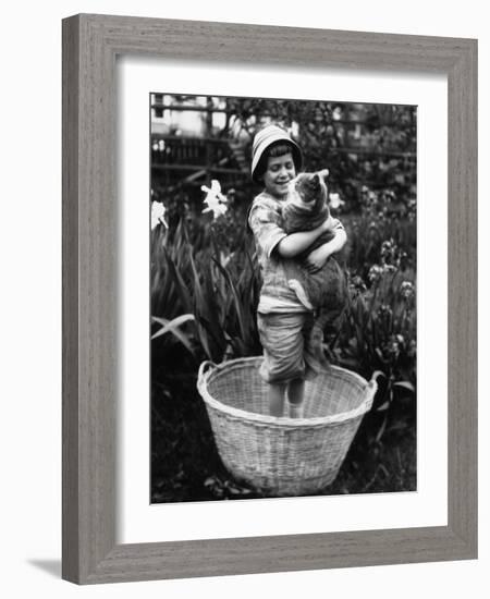 Girl (6-7 Years) Embracing Her Cat-null-Framed Photographic Print