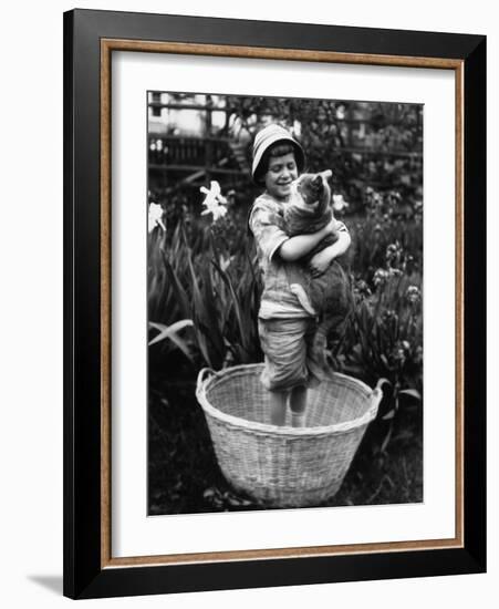 Girl (6-7 Years) Embracing Her Cat-null-Framed Photographic Print