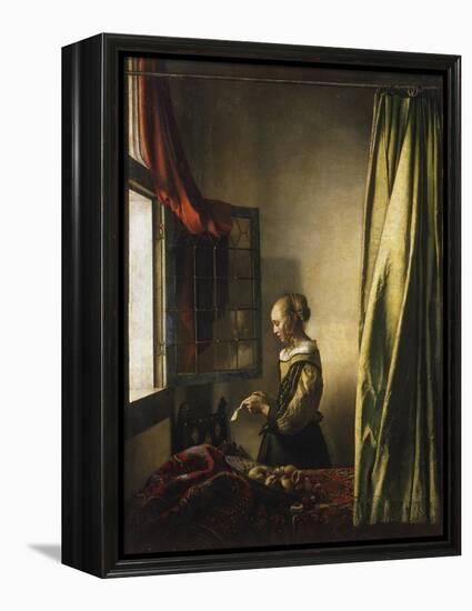 Girl at a Window Reading a Letter, about 1658-Johannes Vermeer-Framed Premier Image Canvas