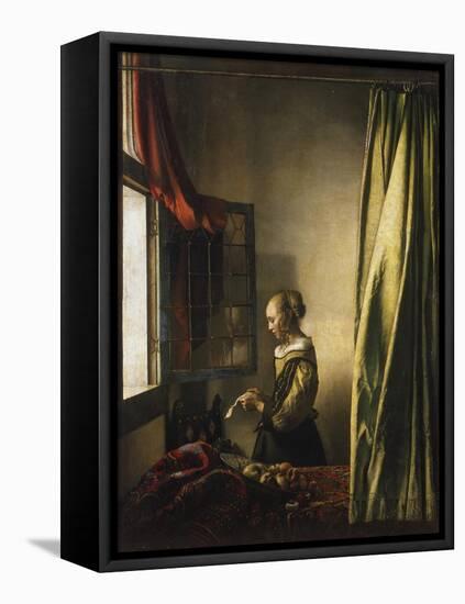 Girl at a Window Reading a Letter, about 1658-Johannes Vermeer-Framed Premier Image Canvas