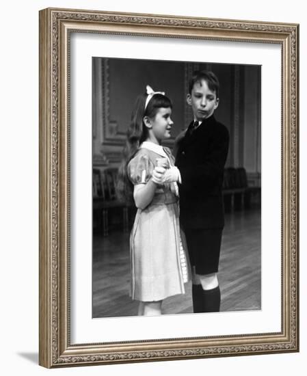 Girl at Ballroom Dancing Class Smiling at Her Partner Who Averts His Glance from Her-Alfred Eisenstaedt-Framed Photographic Print