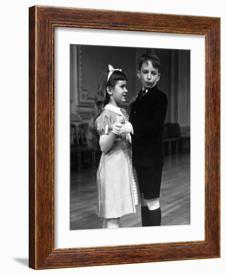 Girl at Ballroom Dancing Class Smiling at Her Partner Who Averts His Glance from Her-Alfred Eisenstaedt-Framed Photographic Print