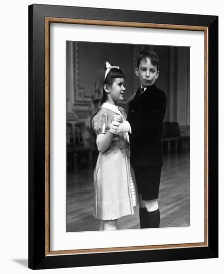 Girl at Ballroom Dancing Class Smiling at Her Partner Who Averts His Glance from Her-Alfred Eisenstaedt-Framed Photographic Print