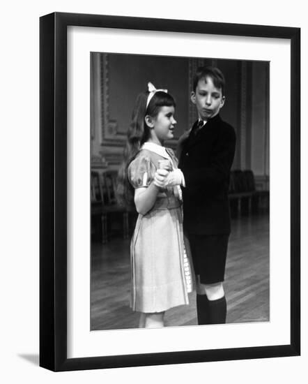 Girl at Ballroom Dancing Class Smiling at Her Partner Who Averts His Glance from Her-Alfred Eisenstaedt-Framed Photographic Print