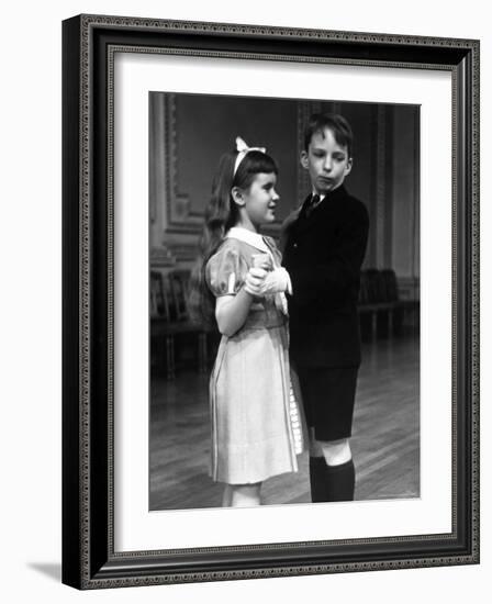 Girl at Ballroom Dancing Class Smiling at Her Partner Who Averts His Glance from Her-Alfred Eisenstaedt-Framed Photographic Print