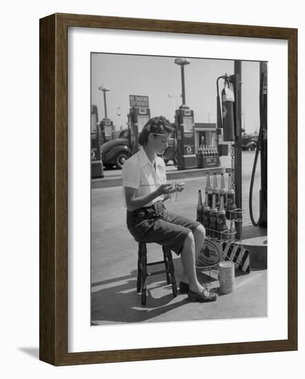 Girl Change Maker Knitting During Slow Moments at the Gilmore Self-Service Gas Station-Allan Grant-Framed Photographic Print