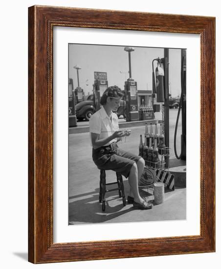 Girl Change Maker Knitting During Slow Moments at the Gilmore Self-Service Gas Station-Allan Grant-Framed Photographic Print