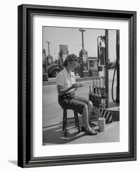 Girl Change Maker Knitting During Slow Moments at the Gilmore Self-Service Gas Station-Allan Grant-Framed Photographic Print