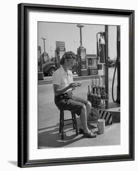 Girl Change Maker Knitting During Slow Moments at the Gilmore Self-Service Gas Station-Allan Grant-Framed Photographic Print