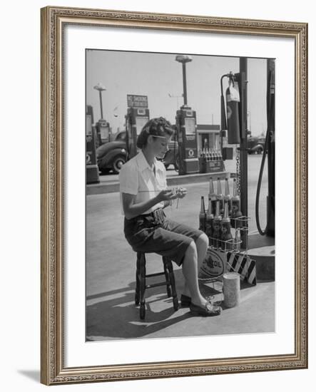 Girl Change Maker Knitting During Slow Moments at the Gilmore Self-Service Gas Station-Allan Grant-Framed Photographic Print