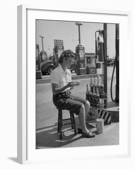 Girl Change Maker Knitting During Slow Moments at the Gilmore Self-Service Gas Station-Allan Grant-Framed Photographic Print