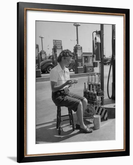 Girl Change Maker Knitting During Slow Moments at the Gilmore Self-Service Gas Station-Allan Grant-Framed Photographic Print
