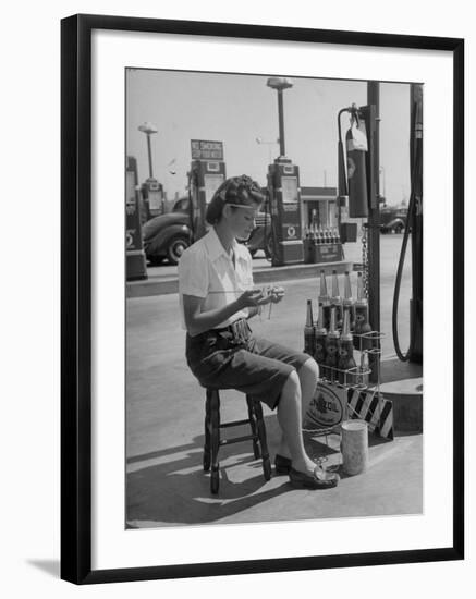 Girl Change Maker Knitting During Slow Moments at the Gilmore Self-Service Gas Station-Allan Grant-Framed Photographic Print