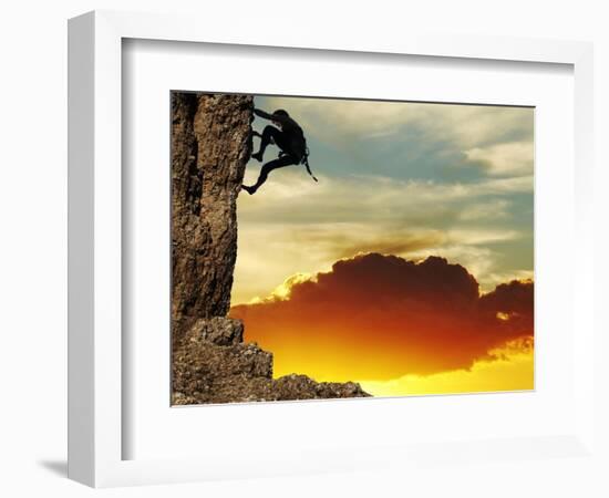 Girl Climbing On The Rock On Sunset Background-Andrushko Galyna-Framed Art Print