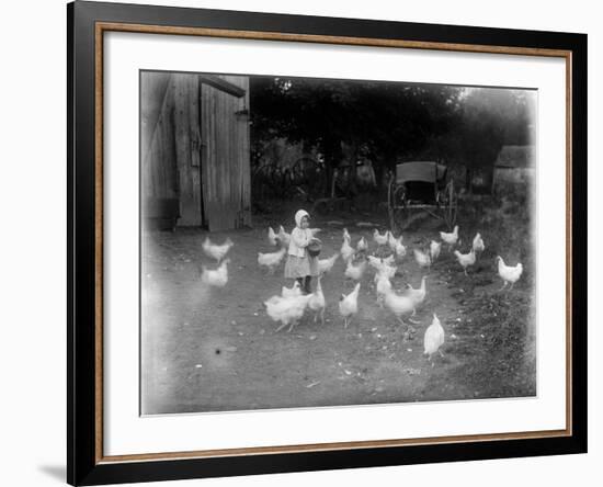 Girl Feeding Chickens-null-Framed Photographic Print