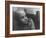 Girl Gazing Pensively Through Pane of Her Apartment Window, Grimly Reflects Image of Berlin Wall-Paul Schutzer-Framed Photographic Print