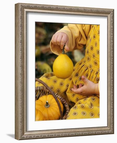 Girl Holding a Baby Pumpkin-Alena Hrbkova-Framed Photographic Print