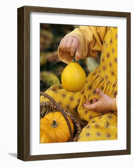 Girl Holding a Baby Pumpkin-Alena Hrbkova-Framed Photographic Print