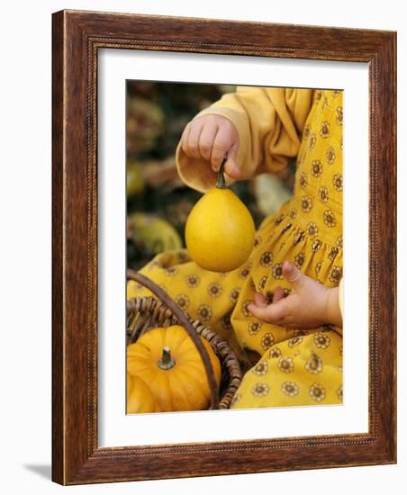 Girl Holding a Baby Pumpkin-Alena Hrbkova-Framed Photographic Print