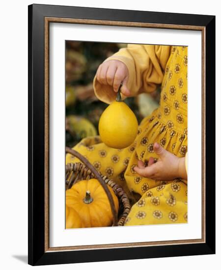 Girl Holding a Baby Pumpkin-Alena Hrbkova-Framed Photographic Print