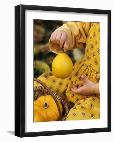 Girl Holding a Baby Pumpkin-Alena Hrbkova-Framed Photographic Print