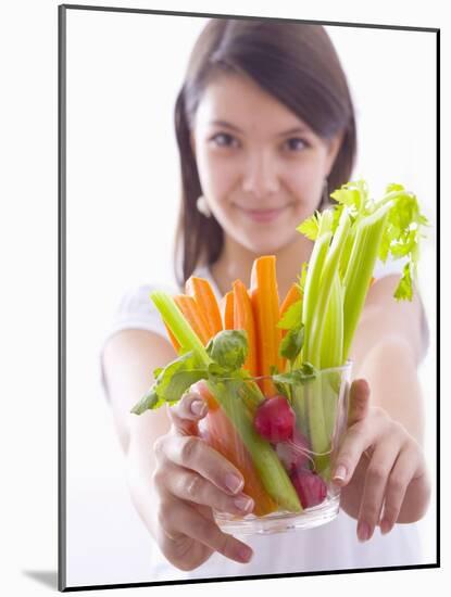 Girl Holding a Bowl of Vegetable Sticks with Radishes-null-Mounted Photographic Print