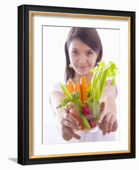 Girl Holding a Bowl of Vegetable Sticks with Radishes-null-Framed Photographic Print