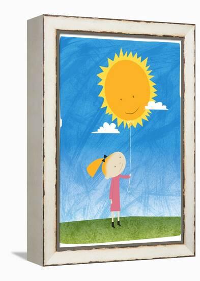 Girl holding a sun balloon-Harry Briggs-Framed Premier Image Canvas