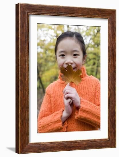 Girl Holding An Autumn Leaf-Ian Boddy-Framed Photographic Print