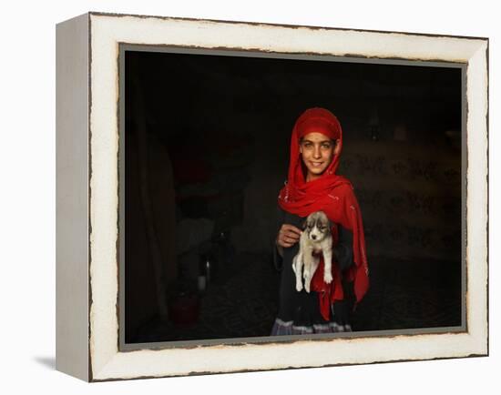 Girl Holds a Puppy as the Sun Sets over Kabul's Impoverished Teppe Maranjan Neighborhood-null-Framed Premier Image Canvas